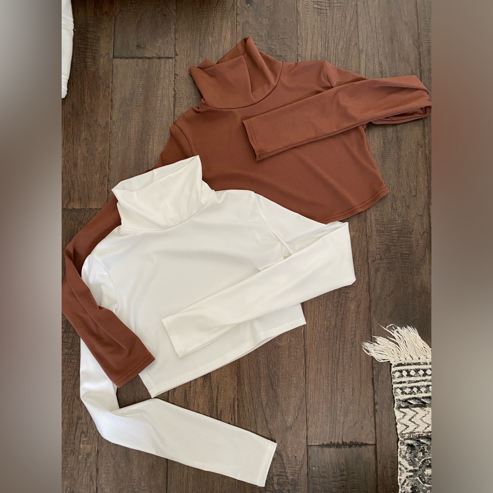 Two cropped turtleneck shirts
